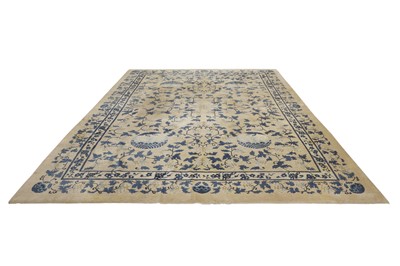 Lot 104 - AN ANTIQUE CHINESE CARPET