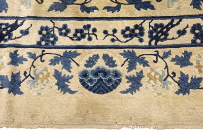 Lot 104 - AN ANTIQUE CHINESE CARPET
