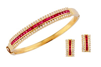 Lot 35 - A ruby and diamond bangle and earclip suite
