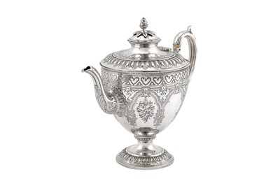 Lot 406 - A Victorian sterling silver three-piece tea service, London 1871/74 by Martin Hall and Co