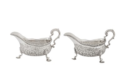 Lot 484 - A pair of George III sterling silver sauce boats, London 1766 by Thomas Heming