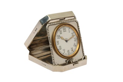 Lot 22 - A GEORGE V STERLING SILVER CASED TRAVELLING TIMEPIECE OR CLOCK, LONDON 1924 BY GOLDSMITHS AND SILVERSMITHS