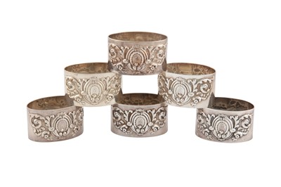 Lot 270 - A SET OF SIX VICTORIAN STERLING SILVER NAPKIN RINGS, LONDON 1896 BY JOSIAH WILLIAMS AND CO