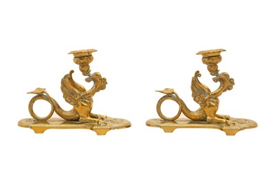 Lot 237 - A PAIR OF BRASS CANDLESTICKS IN THE FORM OF MYTHICAL BEASTS