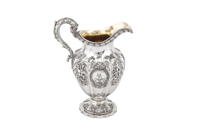 Lot 423 - A large George IV sterling silver milk jug, London 1828 by messrs Barnard