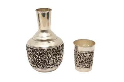 Lot 129 - A CASED MODERN INDIAN SILVER CARAFE AND BEAKER SET