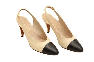 Lot 679 - A PAIR OF CHANEL TWO-TONE SLINGBACK HEELS