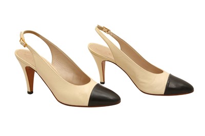 Lot 679 - A PAIR OF CHANEL TWO-TONE SLINGBACK HEELS