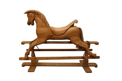 Lot 324 - A LATE 20TH CENTURY CARVED PINE ROCKING HORSE