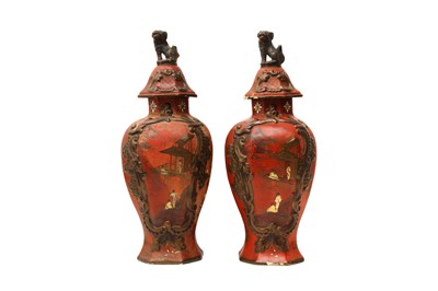 Lot 263 - A PAIR OF RED-GROUND BALUSTER VASES AND COVERS