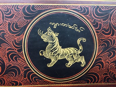 Lot 383 - A BURMESE RED AND BLACK LACQUER 'TIGER' BOX