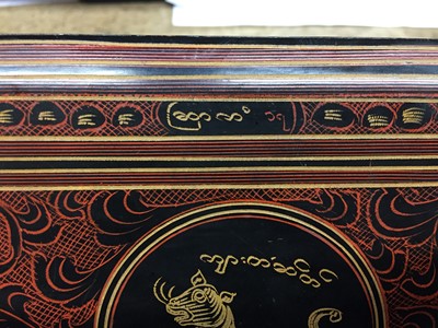 Lot 383 - A BURMESE RED AND BLACK LACQUER 'TIGER' BOX