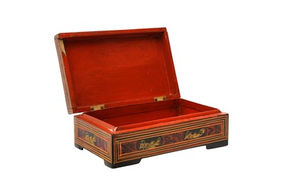 Lot 383 - A BURMESE RED AND BLACK LACQUER 'TIGER' BOX