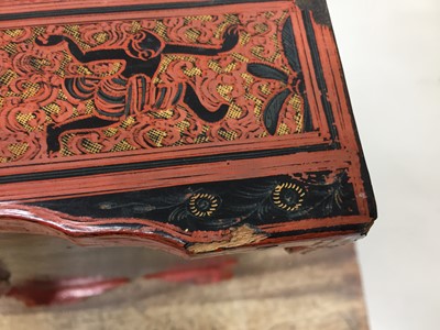 Lot 384 - A LARGE BURMESE RED AND BLACK LACQUER 'ELEPHANTS' BOX AND COVER
