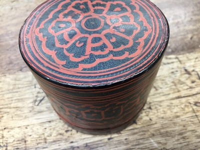Lot 387 - A SMALL BURMESE RED AND BLACK LACQUER BETEL-BOX AND COVER