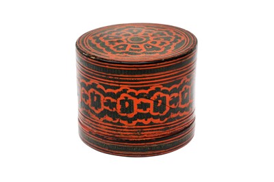 Lot 387 - A SMALL BURMESE RED AND BLACK LACQUER BETEL-BOX AND COVER