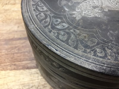 Lot 381 - A BURMESE INCISED BLACK LACQUER 'EQUESTRIAN' BETEL-BOX AND COVER