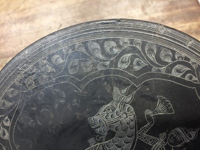 Lot 381 - A BURMESE INCISED BLACK LACQUER 'EQUESTRIAN' BETEL-BOX AND COVER