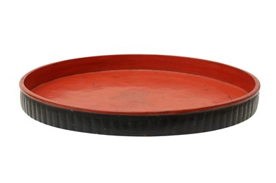 Lot 372 - A LARGE BURMESE RED AND BLACK LACQUER TRAY