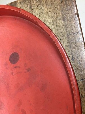 Lot 372 - A LARGE BURMESE RED AND BLACK LACQUER TRAY