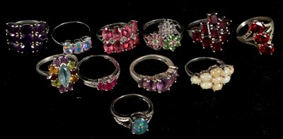 Lot 157 - A collection of 11 semi-precious stone set...