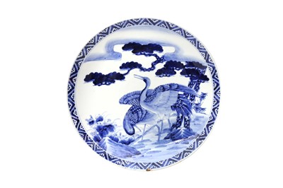 Lot 1032 - A JAPANESE BLUE AND WHITE ARITA 'CRANES' CHARGER