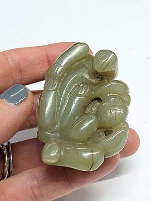 Lot 512 - A GROUP OF TWENTY-TWO CHINESE PALE CELADON JADE CARVINGS