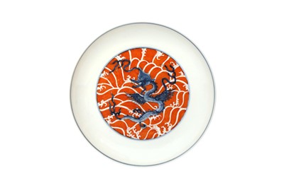 Lot 979 - A CHINESE IRON-RED AND UNDERGLAZE BLUE 'DRAGON' DISH
