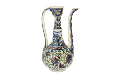 Lot 312 - A POLYCHROME-PAINTED LATE QAJAR POTTERY EWER