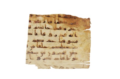 Lot 120 - A FRAGMENT OF A LOOSE KUFIC QUR'AN FOLIO
