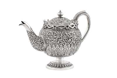 Lot 223 - A late 19th century Anglo – Indian unmarked silver teapot, Cutch circa 1880