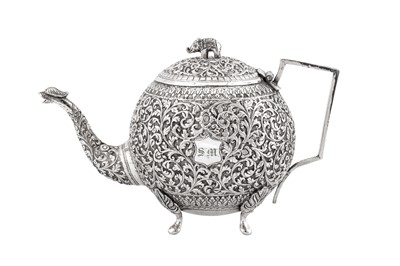 Lot 216 - A late 19th / early 20th century Anglo – Indian unmarked silver teapot, Cutch circa 1900