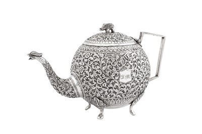 Lot 216 - A late 19th / early 20th century Anglo – Indian unmarked silver teapot, Cutch circa 1900