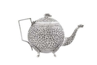 Lot 216 - A late 19th / early 20th century Anglo – Indian unmarked silver teapot, Cutch circa 1900