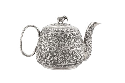 Lot 215 - A late 19th / early 20th century Anglo – Indian unmarked silver bachelor teapot, Cutch circa 1900