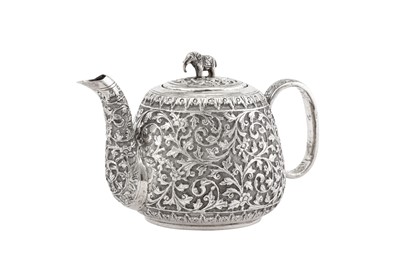 Lot 215 - A late 19th / early 20th century Anglo – Indian unmarked silver bachelor teapot, Cutch circa 1900