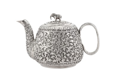 Lot 215 - A late 19th / early 20th century Anglo – Indian unmarked silver bachelor teapot, Cutch circa 1900