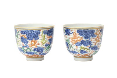 Lot 129 - A PAIR OF CHINESE FAMILLE-ROSE 'DRAGON' CUPS