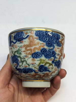 Lot 129 - A PAIR OF CHINESE FAMILLE-ROSE 'DRAGON' CUPS