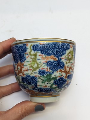 Lot 129 - A PAIR OF CHINESE FAMILLE-ROSE 'DRAGON' CUPS