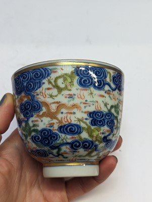 Lot 129 - A PAIR OF CHINESE FAMILLE-ROSE 'DRAGON' CUPS