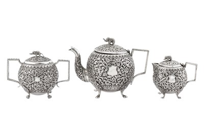 Lot 218 - An assembled late 19th century Anglo – Indian unmarked silver three-piece tea service, Cutch circa 1890