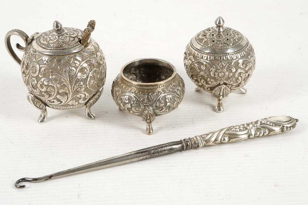 Lot 500 - A Burmese silver globular condiment set, all...