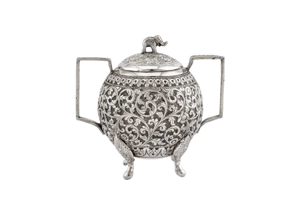 Lot 214 - A late 19th century Anglo – Indian unmarked silver covered twin handled sugar bowl, Cutch circa 1890