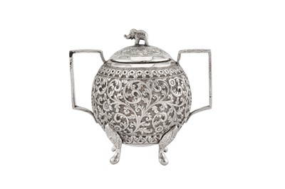 Lot 214 - A late 19th century Anglo – Indian unmarked silver covered twin handled sugar bowl, Cutch circa 1890