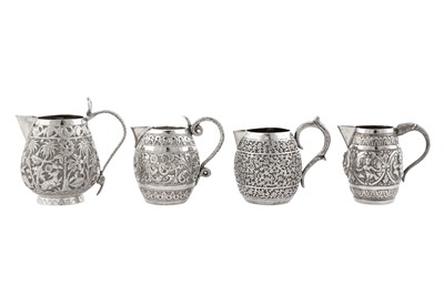 Lot 99 - Three early 20th century Anglo – Indian unmarked silver cream jugs, Lucknow circa 1910