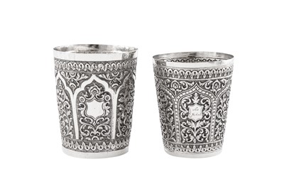 Lot 201 - Two similar early 20th century Anglo – Indian unmarked silver beakers, Cutch circa 1910