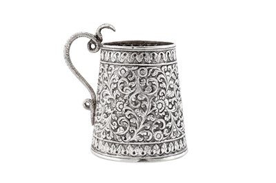 Lot 196 - A late 19th century Anglo – Indian unmarked silver christening mug, Cutch circa 1890