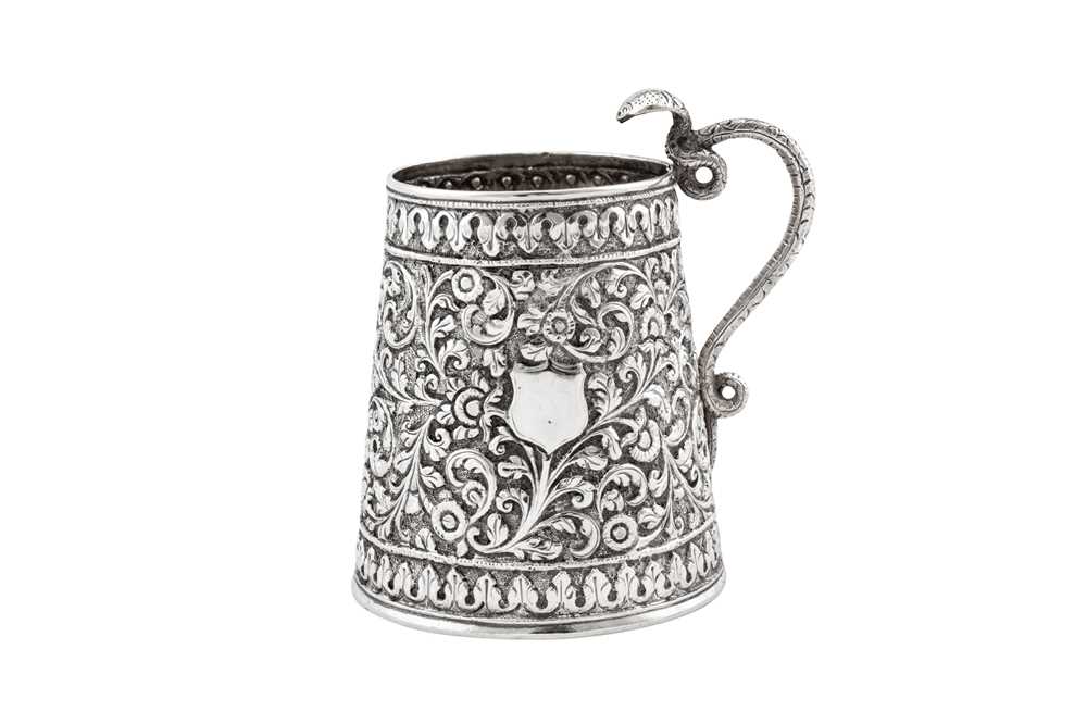 Lot 196 - A late 19th century Anglo – Indian unmarked silver christening mug, Cutch circa 1890