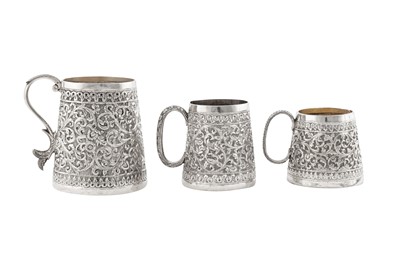 Lot 172 - Three early 20th century Anglo – Indian unmarked silver christening mugs, Bombay-Cutch circa 1910